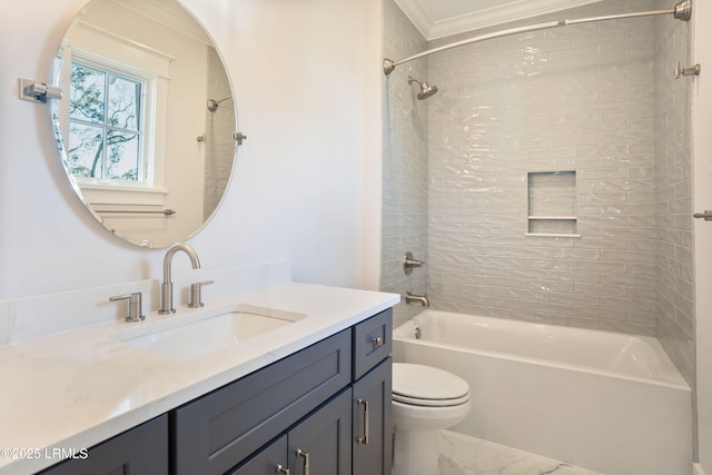 full bathroom featuring vanity, ornamental molding, toilet, and tiled shower / bath