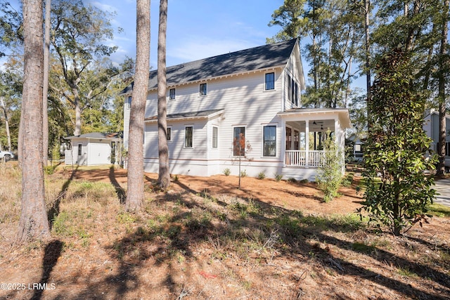 rear view of property with covered porch