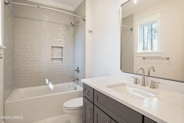 full bathroom with ornamental molding, toilet, tiled shower / bath combo, and vanity