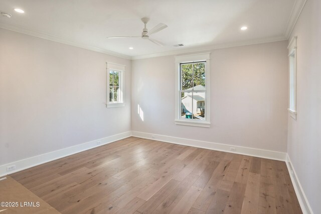 unfurnished room with crown molding, ceiling fan, and light hardwood / wood-style flooring