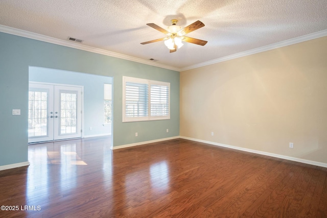 spare room with crown molding, dark hardwood / wood-style floors, french doors, and a textured ceiling