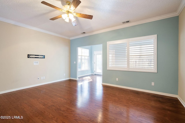 spare room with crown molding, ceiling fan, dark hardwood / wood-style floors, and a textured ceiling