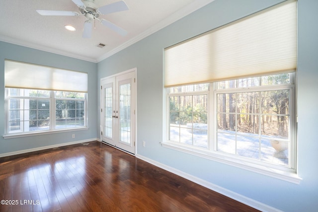 unfurnished room featuring crown molding, dark wood-type flooring, and ceiling fan