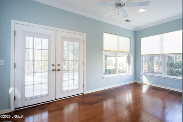 entryway featuring french doors, dark wood-type flooring, a textured ceiling, ornamental molding, and ceiling fan