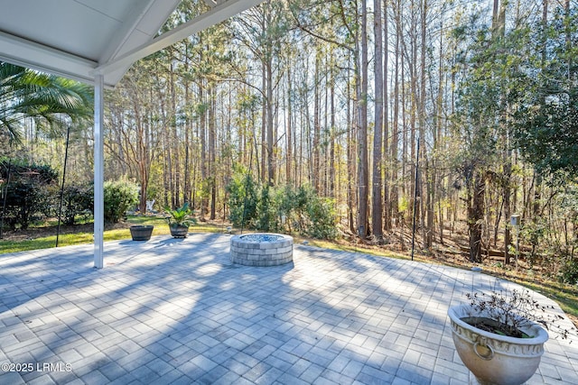 view of patio / terrace with an outdoor fire pit