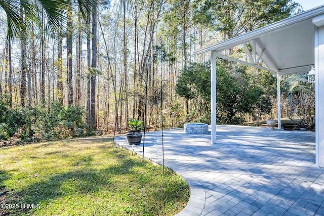 view of swimming pool featuring a yard and a patio area