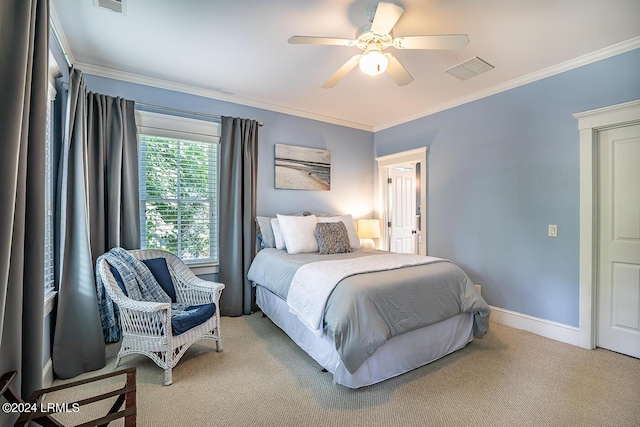 bedroom with ceiling fan, ornamental molding, and light carpet