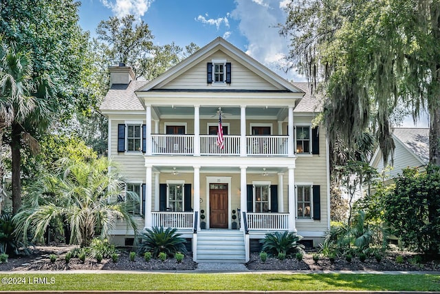 view of front facade featuring a balcony and covered porch