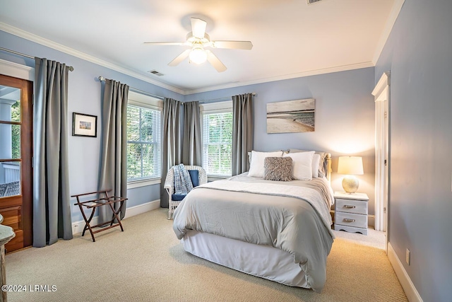 bedroom featuring light carpet, crown molding, and ceiling fan