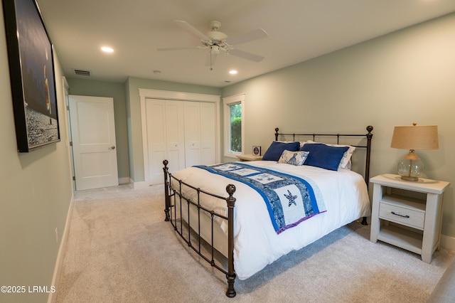 bedroom featuring light carpet, visible vents, baseboards, a closet, and recessed lighting