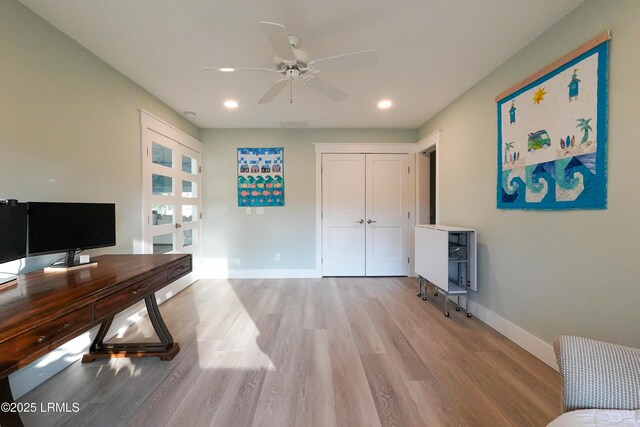 office space featuring ceiling fan, light wood-style floors, recessed lighting, and baseboards