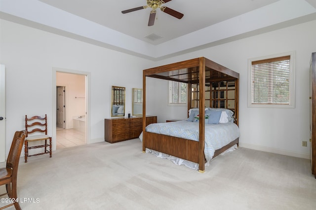 carpeted bedroom with ceiling fan and connected bathroom