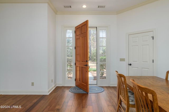 foyer entrance featuring crown molding and wood-type flooring