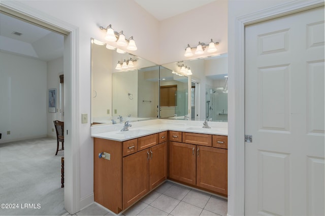 bathroom featuring tile patterned flooring and vanity