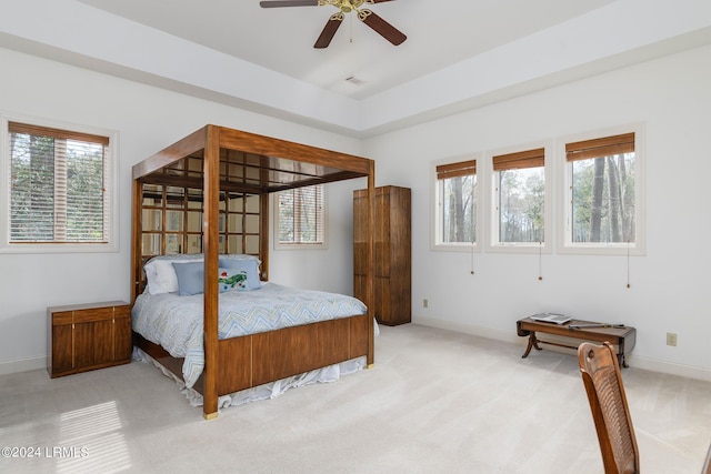 bedroom with light colored carpet and ceiling fan