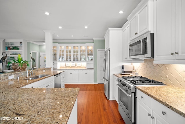208 Cotton Dike Rd, Saint Helena Island, SC 29920 - kitchen with stainless steel appliances, a sink, white cabinetry, crown molding, and recessed lighting