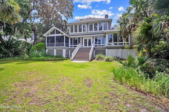 208 Cotton Dike Rd, Saint Helena Island, SC 29920 - rear view of property featuring a sunroom, stairway, a yard, and a chimney