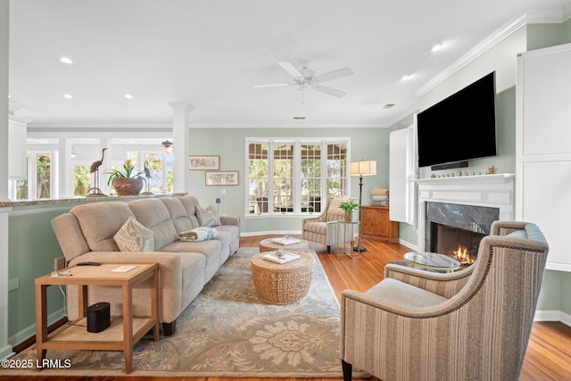 208 Cotton Dike Rd, Saint Helena Island, SC 29920 - living room featuring a ceiling fan, a fireplace, plenty of natural light, crown molding, and recessed lighting