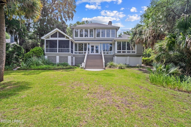 208 Cotton Dike Rd, Saint Helena Island, SC 29920 - back of property with a sunroom, stairway, a chimney, and a yard