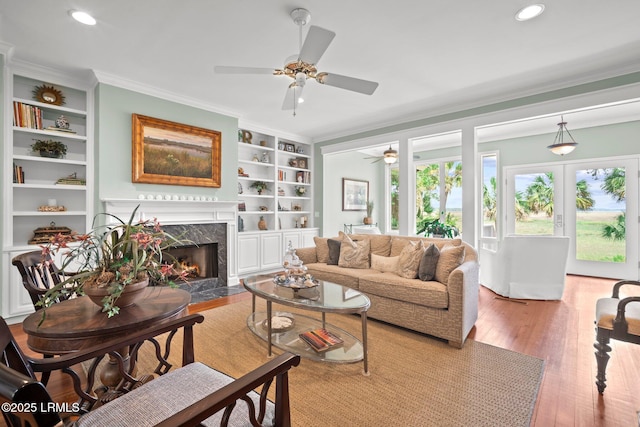 208 Cotton Dike Rd, Saint Helena Island, SC 29920 - living room with a ceiling fan, crown molding, a high end fireplace, wood finished floors, and recessed lighting