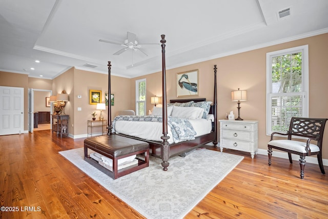 208 Cotton Dike Rd, Saint Helena Island, SC 29920 - bedroom featuring multiple windows, a raised ceiling, light wood-style flooring, baseboards, and recessed lighting