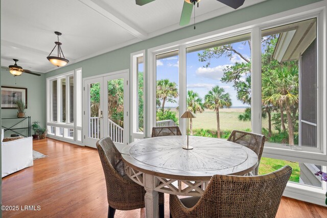 208 Cotton Dike Rd, Saint Helena Island, SC 29920 - sunroom with a deck, wood finished floors, beam ceiling, and french doors
