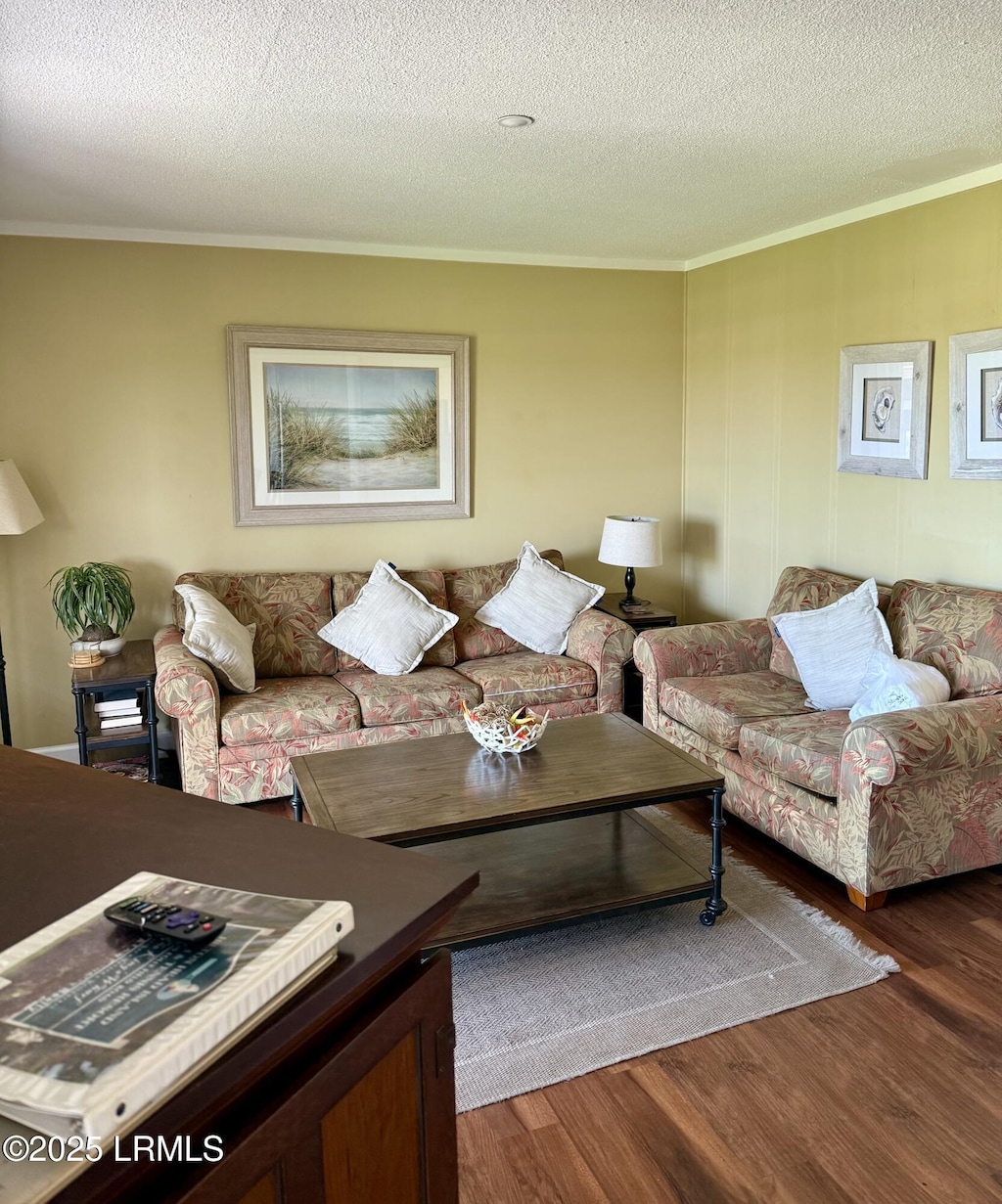 40 Folly Field Rd Unit 428, Hilton Head Island, SC 29928 - living room featuring crown molding, wood finished floors, and a textured ceiling