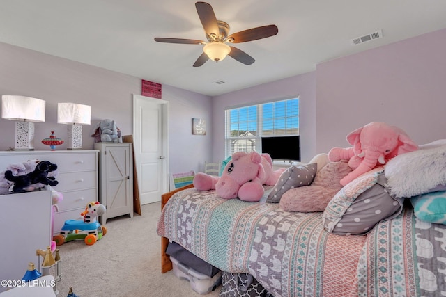 bedroom with light carpet and ceiling fan