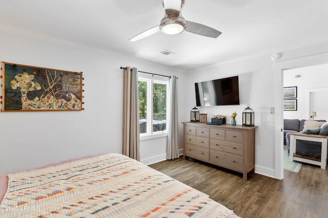 12 Harvest Ln, Beaufort, SC 29907 - bedroom featuring crown molding, baseboards, wood finished floors, and visible vents