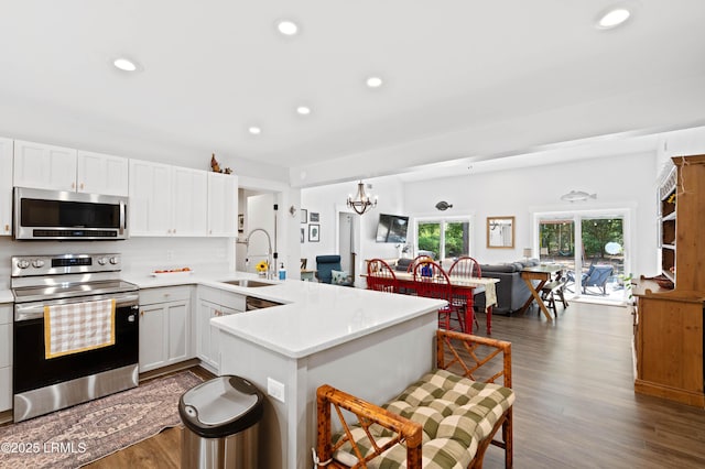 12 Harvest Ln, Beaufort, SC 29907 - kitchen with a peninsula, open floor plan, recessed lighting, a sink, and appliances with stainless steel finishes