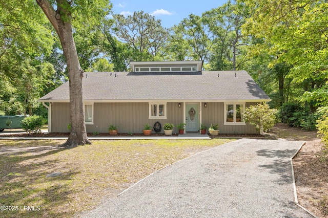 12 Harvest Ln, Beaufort, SC 29907 - view of front of house with roof with shingles and gravel driveway