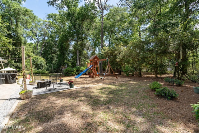 12 Harvest Ln, Beaufort, SC 29907 - view of yard with a patio, a playground, and a fire pit