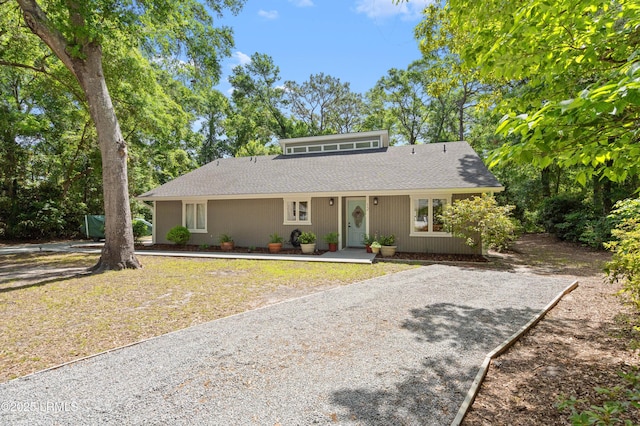 12 Harvest Ln, Beaufort, SC 29907 - view of front facade featuring a shingled roof and gravel driveway
