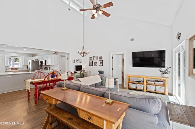 12 Harvest Ln, Beaufort, SC 29907 - living area featuring high vaulted ceiling, ceiling fan with notable chandelier, wood finished floors, and visible vents