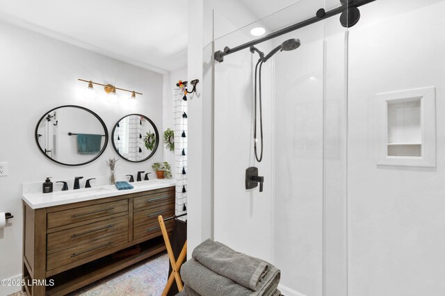 12 Harvest Ln, Beaufort, SC 29907 - bathroom with double vanity, a shower stall, and a sink
