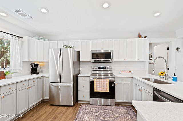 12 Harvest Ln, Beaufort, SC 29907 - kitchen featuring visible vents, appliances with stainless steel finishes, a sink, light countertops, and recessed lighting