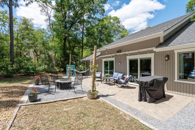 12 Harvest Ln, Beaufort, SC 29907 - view of patio / terrace featuring an outdoor living space with a fire pit