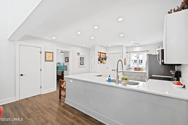 12 Harvest Ln, Beaufort, SC 29907 - kitchen with dark wood-style flooring, electric range, a peninsula, recessed lighting, and a sink