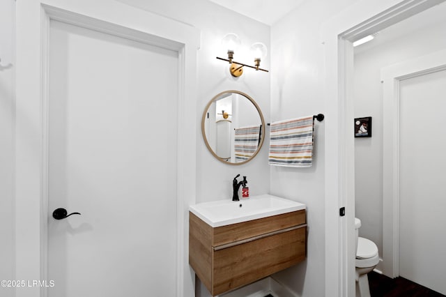 12 Harvest Ln, Beaufort, SC 29907 - bathroom with toilet, wood finished floors, and vanity