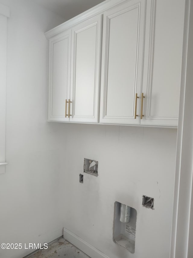 laundry room featuring washer hookup and cabinets