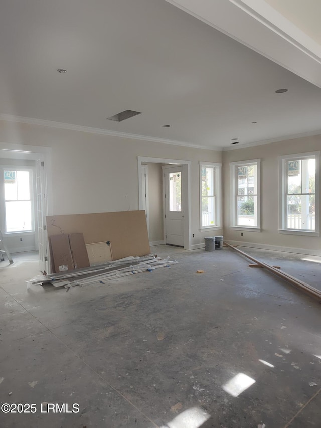 unfurnished living room featuring ornamental molding