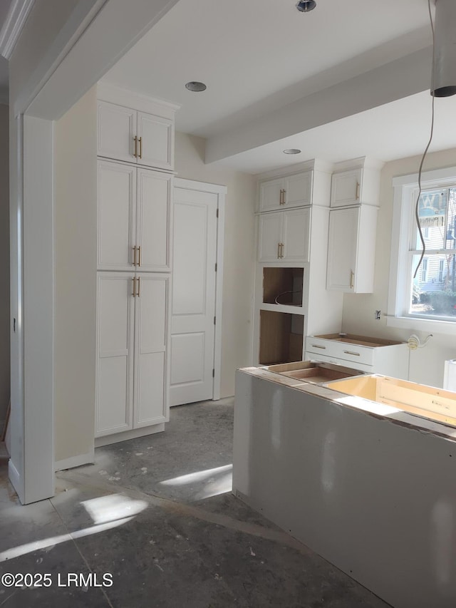 kitchen featuring white cabinetry