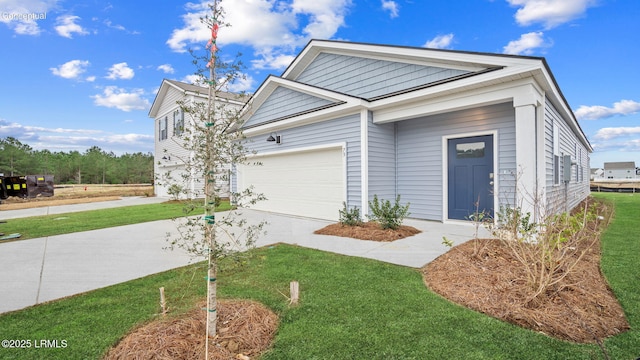 1533 Sanctum St, Ridgeland, SC 29936 - view of front of house featuring driveway, a front lawn, and an attached garage