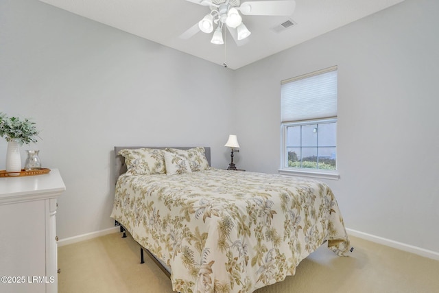 bedroom featuring ceiling fan and light colored carpet