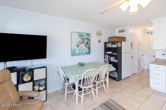 40 Folly Field Rd Unit 202B, Hilton Head Island, SC 29928 - dining space featuring light tile patterned floors, ornamental molding, and ceiling fan