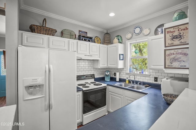 1009 9th St, Port Royal, SC 29935 - kitchen featuring white appliances, under cabinet range hood, white cabinets, crown molding, and tasteful backsplash