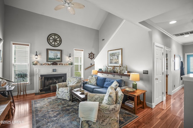 1009 9th St, Port Royal, SC 29935 - living area with ceiling fan, crown molding, wood finished floors, a fireplace with flush hearth, and recessed lighting