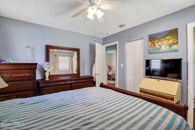 bedroom featuring visible vents and a ceiling fan
