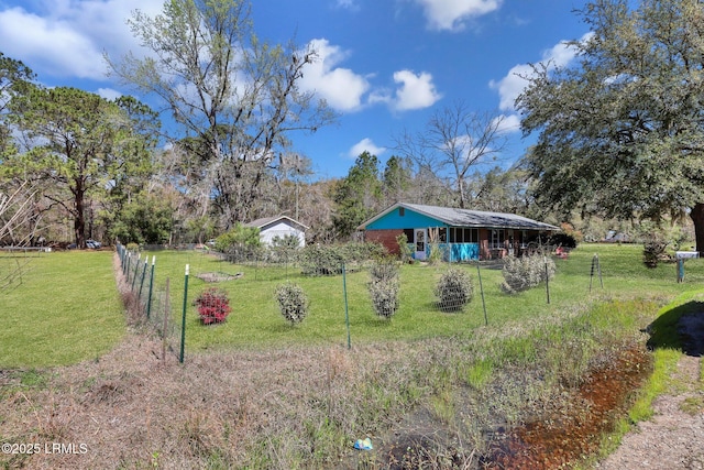 view of yard featuring fence