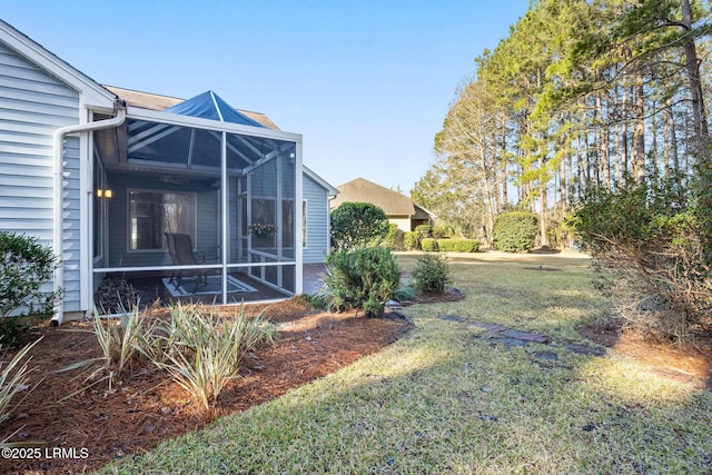 view of yard featuring glass enclosure